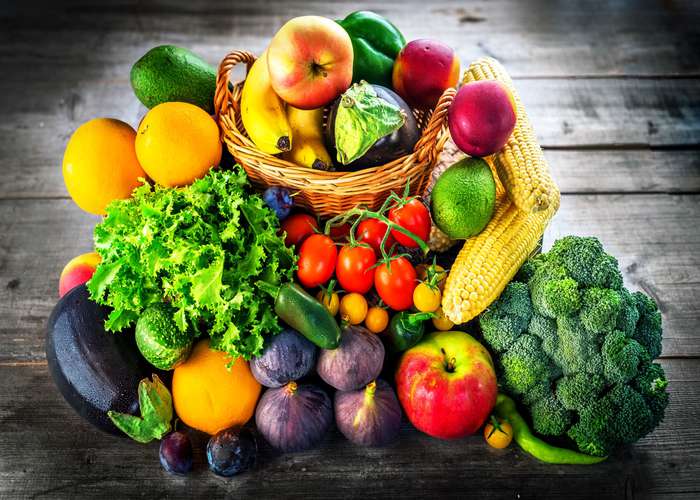 Eat fruits and vegetables for arthritis: display of various fruits and vegetables in a food basket.