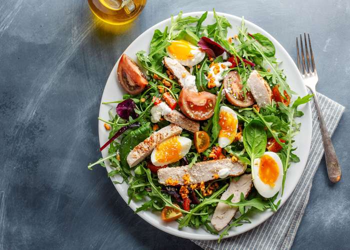 Eat sulfur rich foods for arthritis: plate full of sulfur rich foods including eggs and tomatoes.