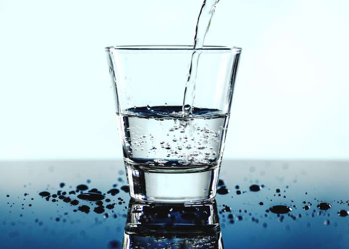 Drink lot of water for Lyme disease: glass of water.