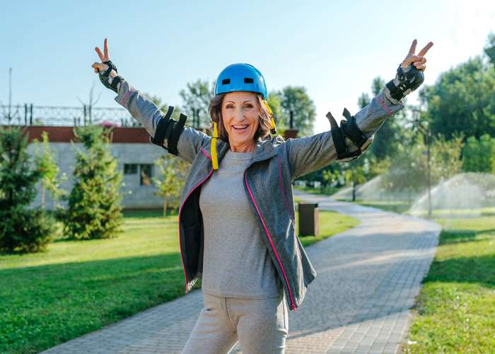 Take time for yourself: woman walking out in nature and enjoying what she is doing to reduce stress.