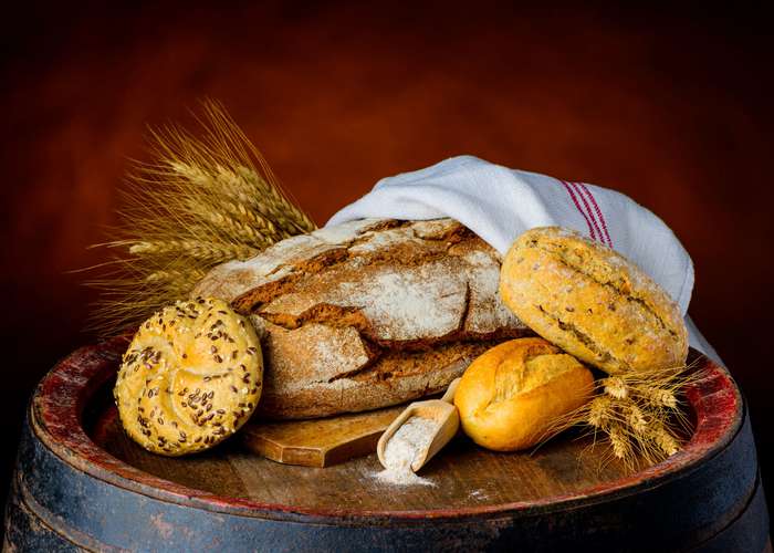 Avoid FODMAP foods for IBS: different types of bread on a tray.
