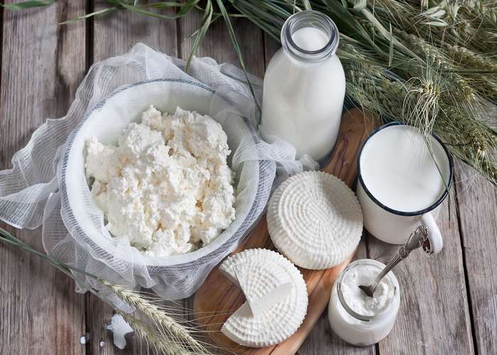 Reduce dairy consumption for Parkinson: variety of dairy products including milk, cheese, and sour cream