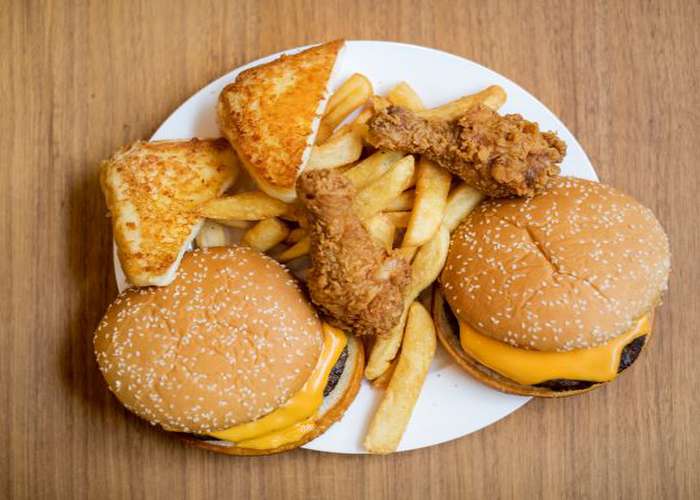Avoid junk food for IBS: cheese burgers, fries, and fried chicken.