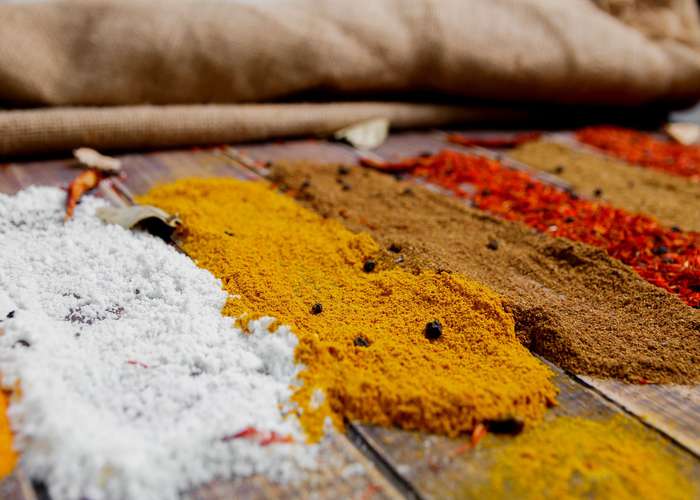 Avoid spicy foods for IBS: variety of different spices display.