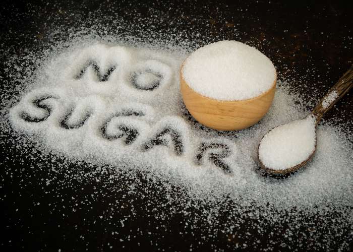Avoid sugar for Lyme disease: no sugar, written on sugar grains.