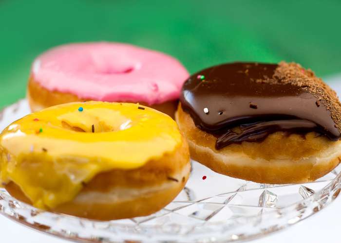 Avoid trans fats for IBS: different donuts with cream and chocolate.